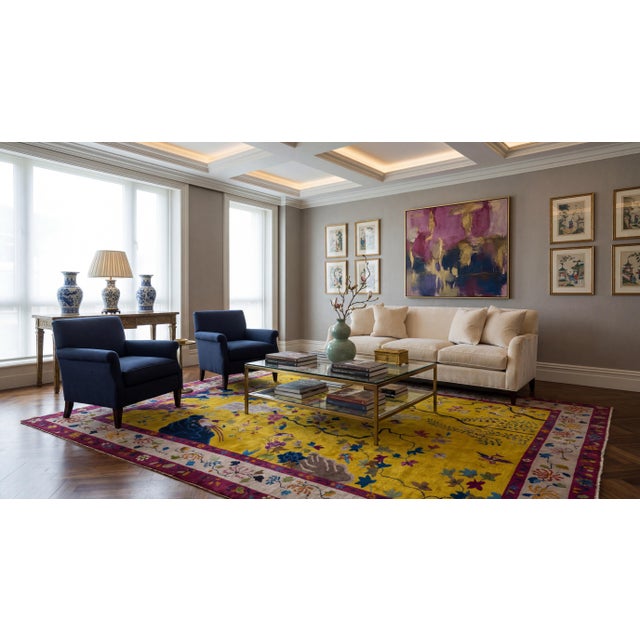 This exquisite Antique Chinese Art Deco rug from the 1920s features a vibrant Imperial Gold field adorned with a "Hundred...
