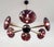 Italian chandelier with Murano glass shades, mounted on polished brass frame with black enameled center and ceiling canopy...