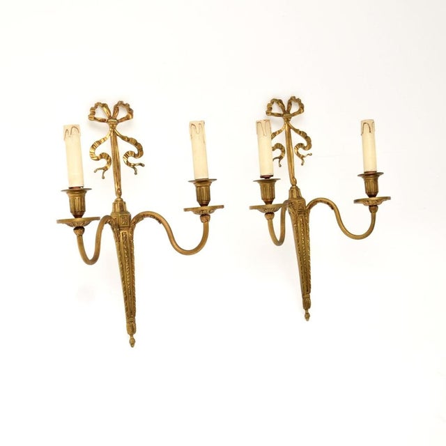 A stunning pair of antique gilt bronze wall sconce lights. They were made in England, they date from around the 1920’s....