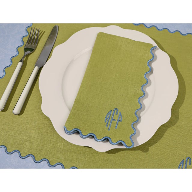 Add a little extra polish to your place settings with The Vivienne dinner napkins—where timeless linen meets a playful...