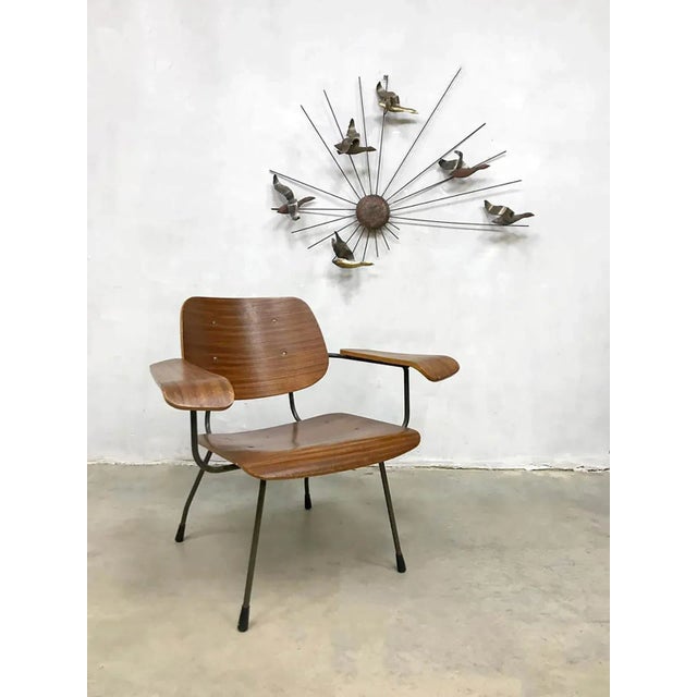 This very special chair was designed by Tjerk Reijenga in 1962 for Pilastro Zwanenburg. It was made using plywood molding...