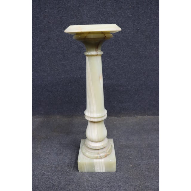 Rare Italian pedestal crafted entirely from richly veined green onyx. The architectural form features a square stepped...
