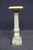Rare Italian pedestal crafted entirely from richly veined green onyx. The architectural form features a square stepped...