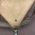 A beautiful pendant features a 1.03-carat rhodolite gemstone with a halo of natural earth-mined diamonds and a diamond-...