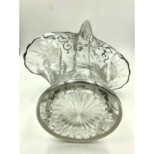 Incredible early 20th century floral wedding basket featuring an etched floral design on the bottom area and a garland...