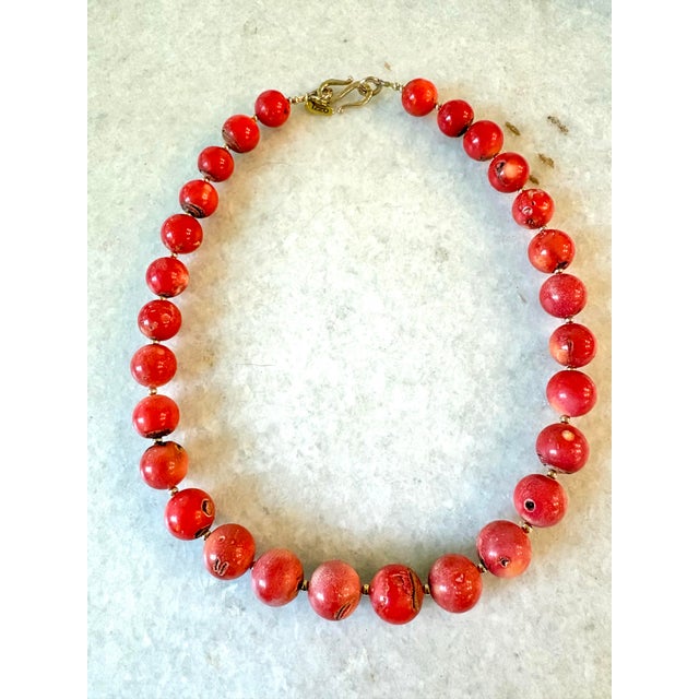 Stunning coral necklace with gold tone spacers and clasp. Designed by Matthew Izzo