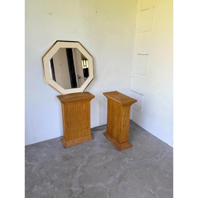 Old mirror from the 70s, octagonal in shape, with its white lacquered wooden frame and brass frames, by Jean-Claude Mahey....