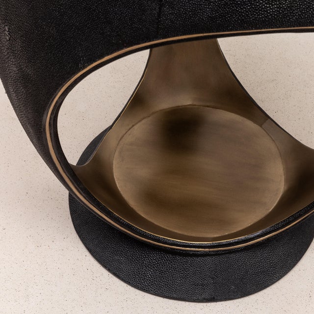 The Ring Stool by R&Y Augousti is an elegant fusion of luxurious materials and modern design. Upholstered in plush black...