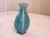 This crackle glaze ceramic vase measures 9.5"H x 4"W.