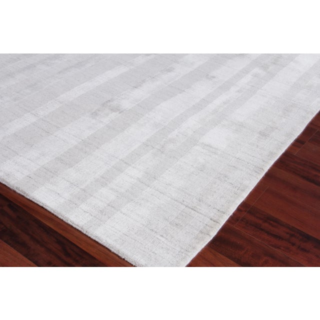 The linear tonal design of the Iscar rug is at once casual, chic and ultra sophisticated. Made of luxurious bamboo silk,...