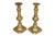A pair of antique brass candlestick holders. Traditional baluster turned columns support simple capitals and finish with...