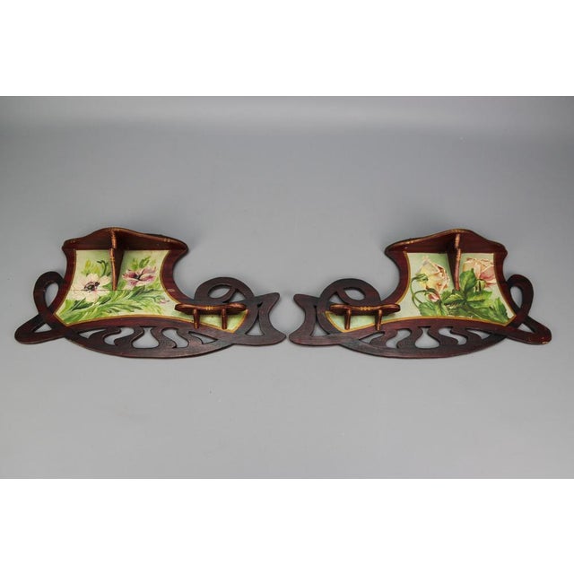 A beautiful pair of antique Art Nouveau period wooden shelves/consoles with hand-painted floral decors. These adorable...