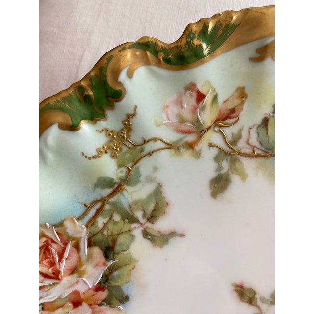 Stunningly beautiful Limoges hand painted porcelain decorative plate with a rococo-style scalloped edge created between...