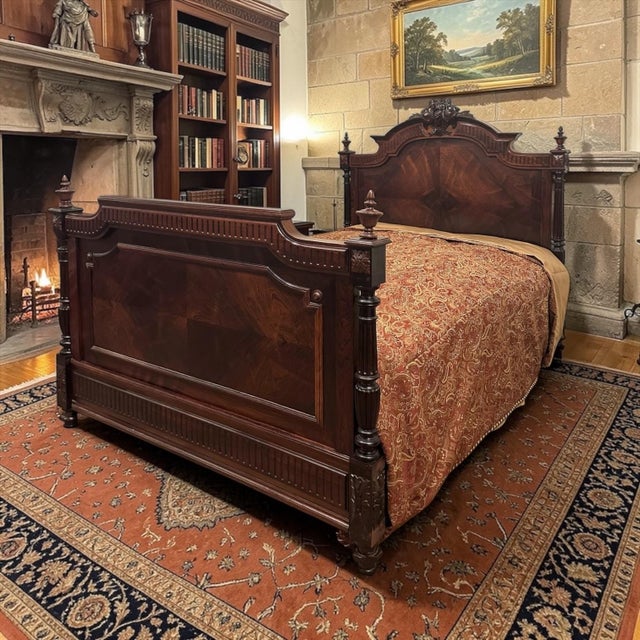 Antique 19th Century French Napoleon III Period Rosewood Bed Frame embodies the refined neoclassical taste that flourished...