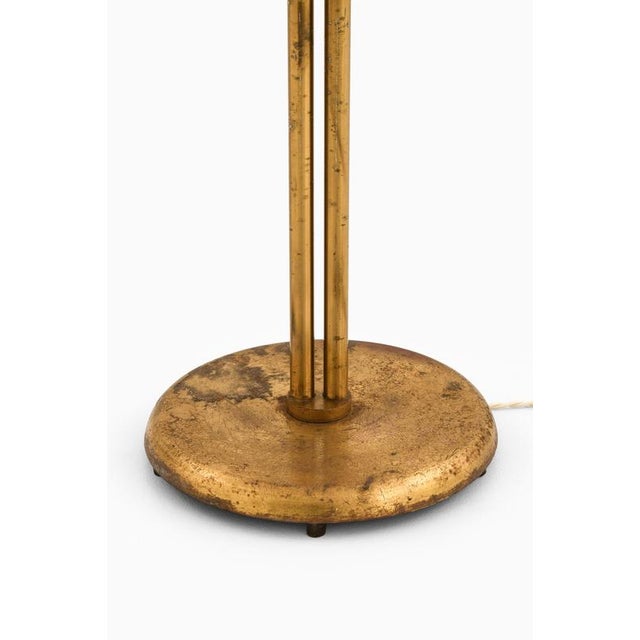 This rare height-adjustable floor lamp, produced in sweden during the 1950s, is a striking example of scandinavian modern...