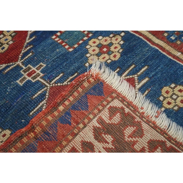 Although suffering from severe end reduction with both outer minor borders lost, this all naturally dyed, Fachralo Kazak...