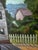 Charming vintage original oil painting depicting an idyllic coastal village overlooking a harbor, signed V. Grass and...