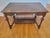 A handsome early twentieth-century American Colonial Revival writing desk crafted in solid walnut (or walnut-finished...