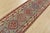 A tribal Caucasian Kazak runner hand-knotted with fine wool on a cotton foundation. This rug features a row of geometric...