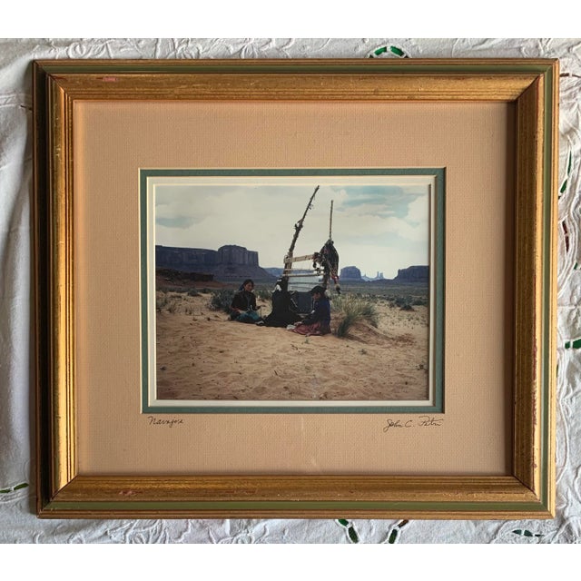 Vintage framed photograph of Navajo women in the desert. Signed, John C Petri. Image measures 8 x 10”.
