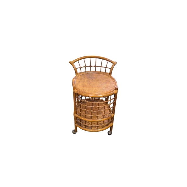 1970's bamboo rolling bar cart. Vintage piece in excellent used condition. 2 tier shelving on this oval rolling bar cart...