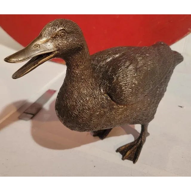 Great Brass design standing duck ornament. This ornament has great color and patina from age. The surface has great textures.