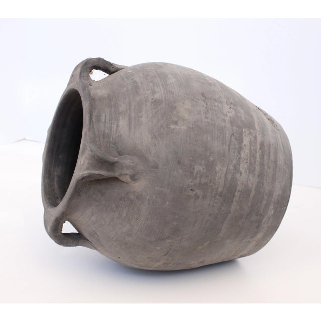 Pair of handcrafted distressed vintage clay pottery vessels. Crafted by skilled artisans with unique rare four handles...