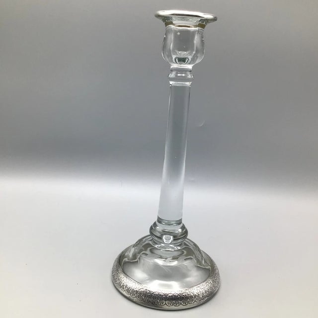 Beautiful pair of tall crystal candle holders with silver band applied to the top and base.