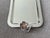 This small silver plated rectangular tray by Christofle France features an elegant handle fashioned after a fully bloomed...