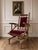 A striking Danish oak highback platform rocking chair, circa 1970s, in the manner of Henning Kjærnulf. The chair features...