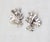 1950s rhodium plated small round clear rhinestones floral spray clip earrings. Marked "PENNINO" on the clip backs....