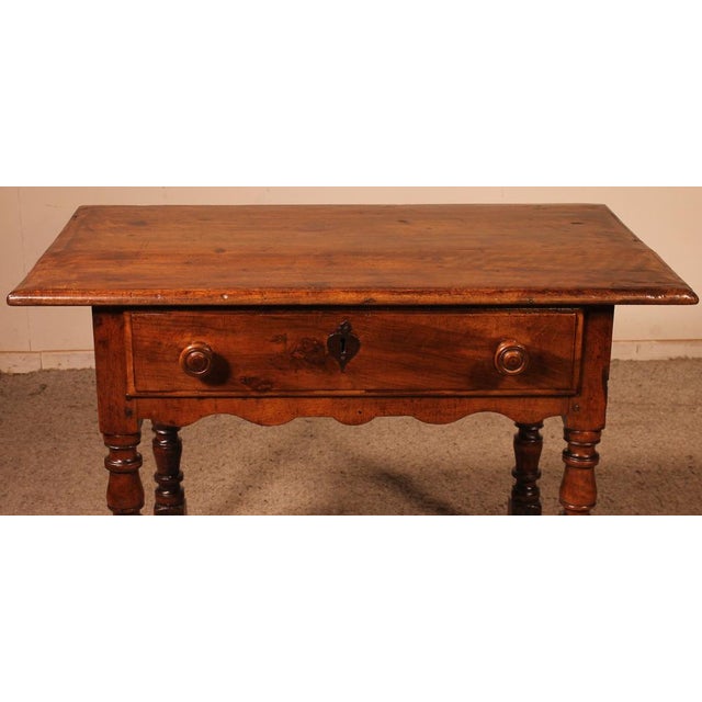 lovely little table in walnut from the 17th century (from Italy) opening with a drawer on the front resting on a very...