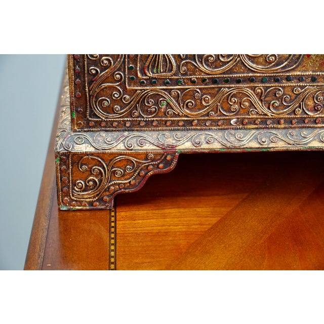 This vintage Burmese temple box is a remarkable example of Southeast Asian craftsmanship, richly decorated with gilt wood...