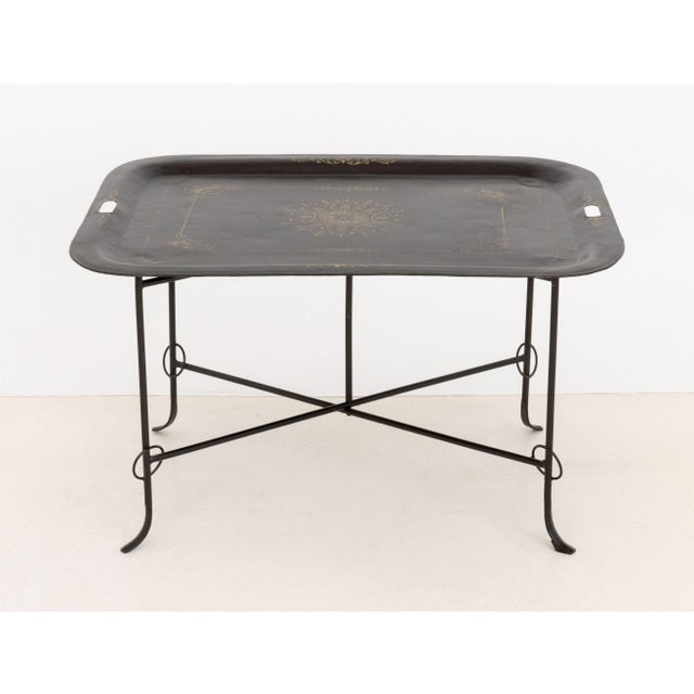 Vintage Tole Painted Tray Table, removable tray top with stenciled gilt floral motif mounted on folding wrought iron base....