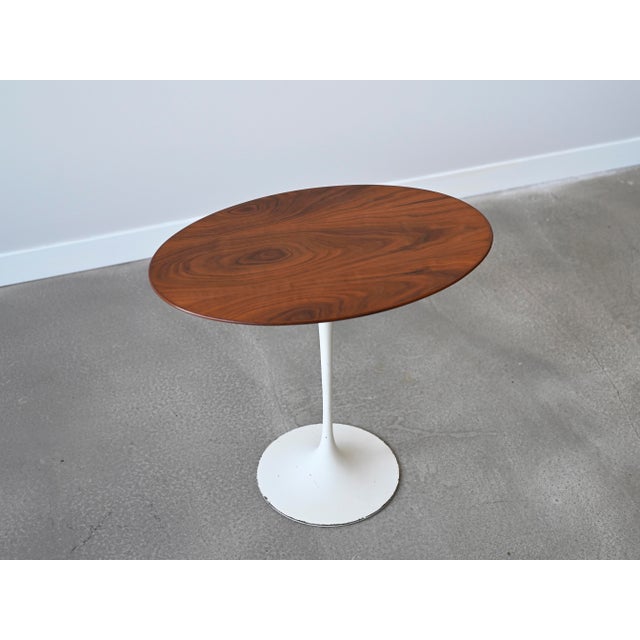 Vintage tulip side table with a stunning oval top in walnut designed by Eero Saarinen for Knoll. Designer: Eero Saarinen...