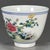 This is a charming vintage porcelain teacup, decorated in the wucai palette with vibrant polychrome enamels. The cup...