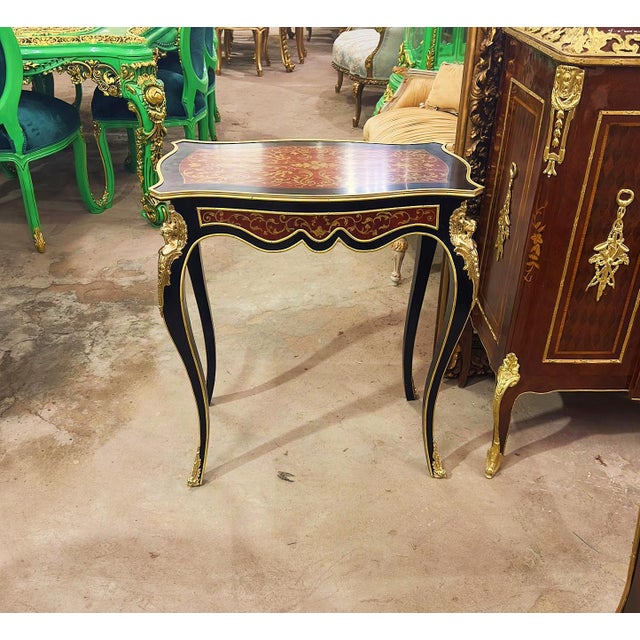 Beautiful side table with gold details. This nightstand can be used to give a classic but elegant touch to your home. The...