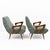 Elegant pair of Italian mid-century modern armchairs, distinguished by their generous, enveloping silhouettes and finely...