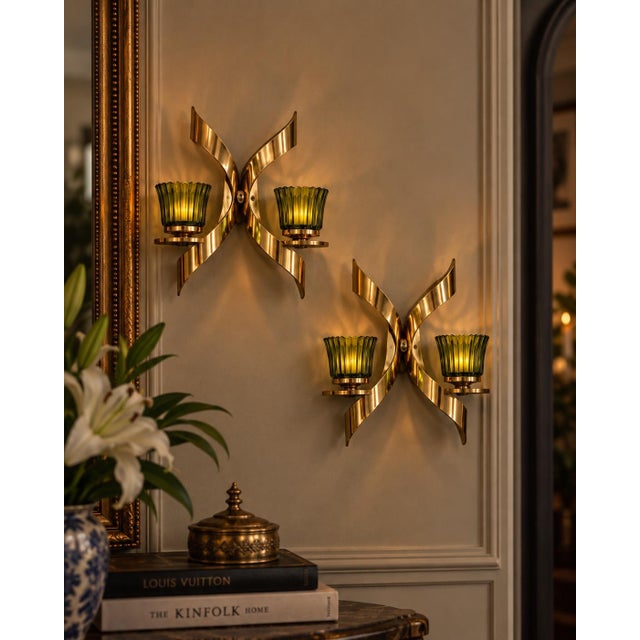 Striking vintage pair of Mascot Pat Pending gold-tone wall candle sconces featuring sculptural ribbon-like geometric forms...