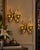 Striking vintage pair of Mascot Pat Pending gold-tone wall candle sconces featuring sculptural ribbon-like geometric forms...