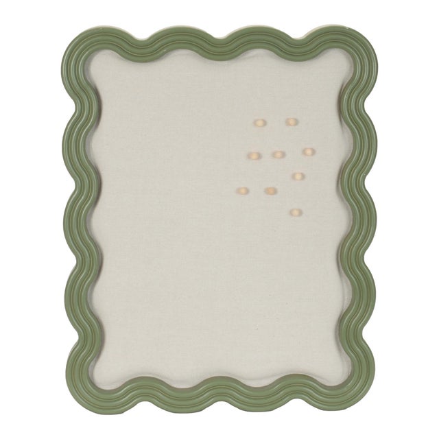 Add a playful yet functional accent to your space with this scalloped pin board frame, featuring a softly curved design...