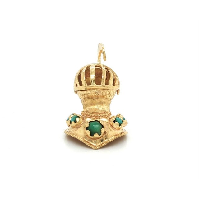 This finely crafted pendant depicts a detailed medieval knights helmet, beautifully designed in solid 18k yellow gold...