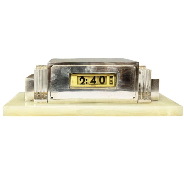 An early circa 1930s cyclometer model 975 electric digital clock housed in a wonderful silver architectural case with...