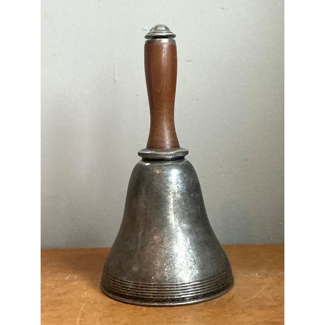 Vintage Nautical Bell Cocktail Shaker is a charming early 20th-century bar accessory with a distinctly maritime character....