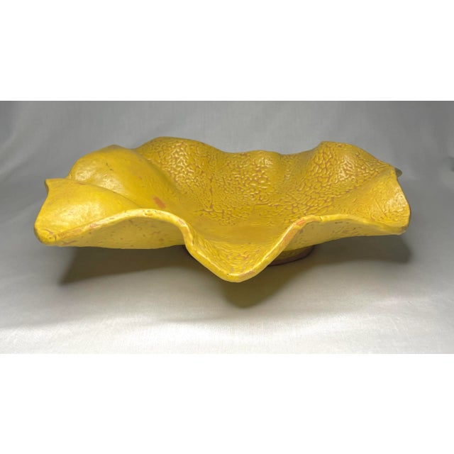 The satin finish and mottled texture bring out the rich yellow color and terra cotta underlay of this Studio Pottery...