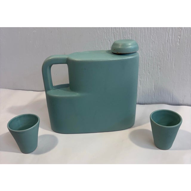 Love this rare art deco decanter set with two matching glasses.