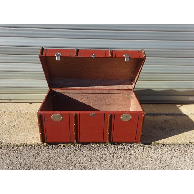 Storage trunk, originally a cabin trunk for transporting personal belongings during train or boat travel. This early 20th-...