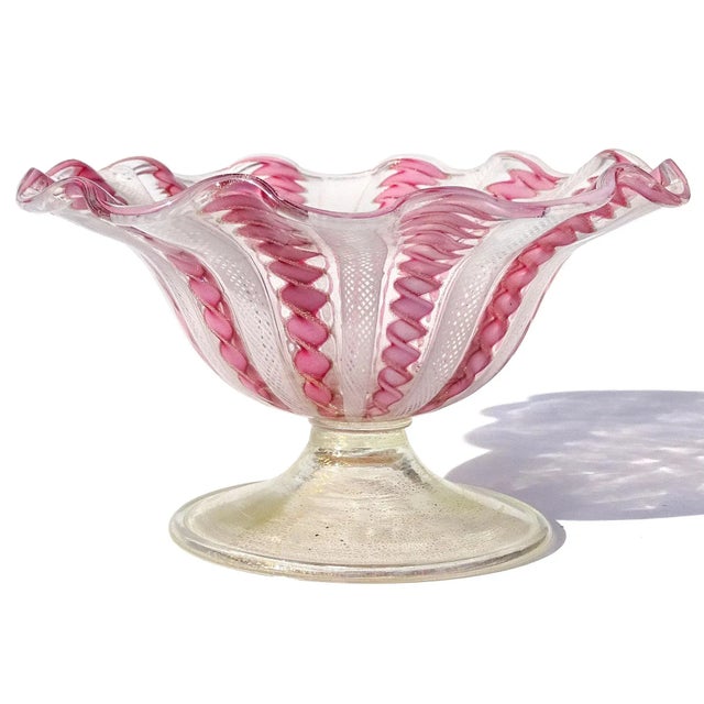 Beautiful vintage Murano hand blown white and pink ribbons Italian art glass flower shape ruffle rim footed bowl. The bowl...
