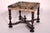 Antique William and Mary style walnut bench, 19th century. With an 18th century tapestry seat, baluster and ring turned...