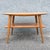 Classic vintage Heywood-Wakefield two-tier table featuring the streamlined simplicity and warm blonde wood finish...